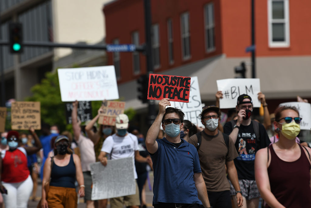Protesters march west on East Broadway